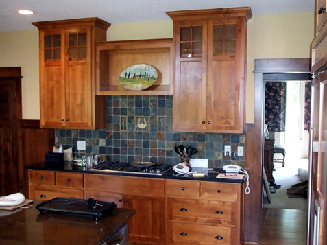 Staggered Heights & Depths of these uppers create the focal point of this wall