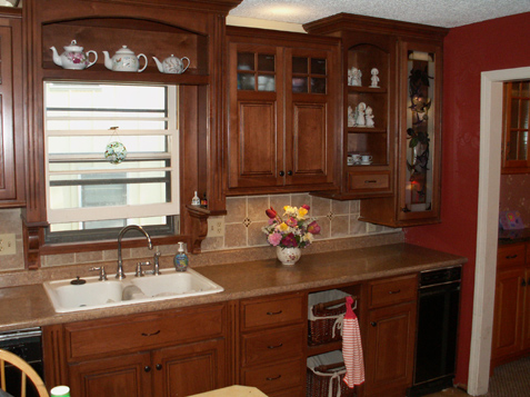 Fluted trim accents and open displays in these custom kitchen cabinets overland park kansas