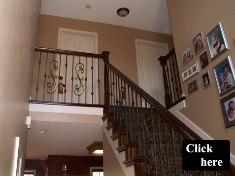 Updated Stairs with Iron Spindles and Wood Stair Treads
