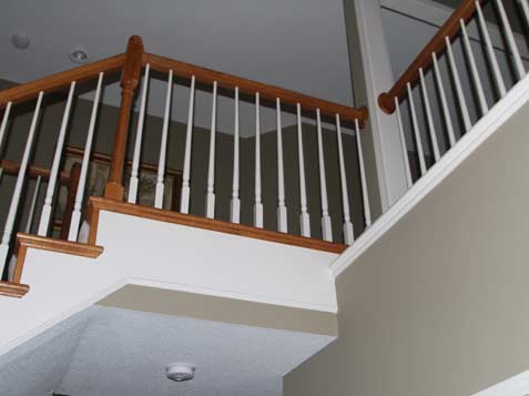 Change dated poolcue wood balusters with wrought iron spindles