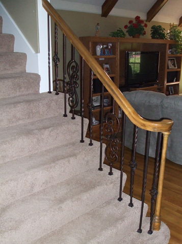 Keeping the existing rail and carpet - Replacing spindles to update your home makes economic sense