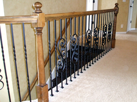Opposing Scroll iron spindles set the pattern