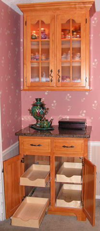 custom dining room hutch cabinet with KC Wood's brand rollout shelves featuring full extension glides and 1/2" bottoms (guaranteed not to break) - Top section has fluted glass and is backlit which is stunning with the room lights dimmed.