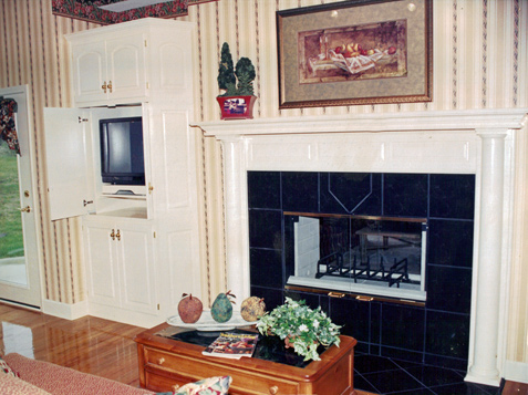 Mantle with Round half columns, Raised-Panel Spanner - Bookcase built-in with TV and related equipment